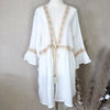 Kaftan with fluted sleeves and pastel embroidery detail and tie