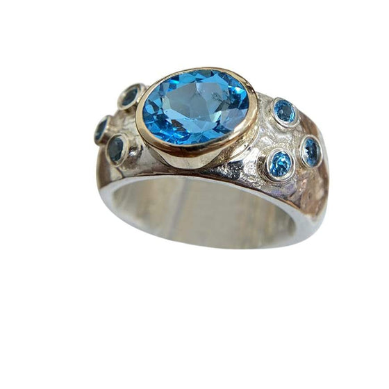 Blue Topaz set in Gold with Sterling Silver Band